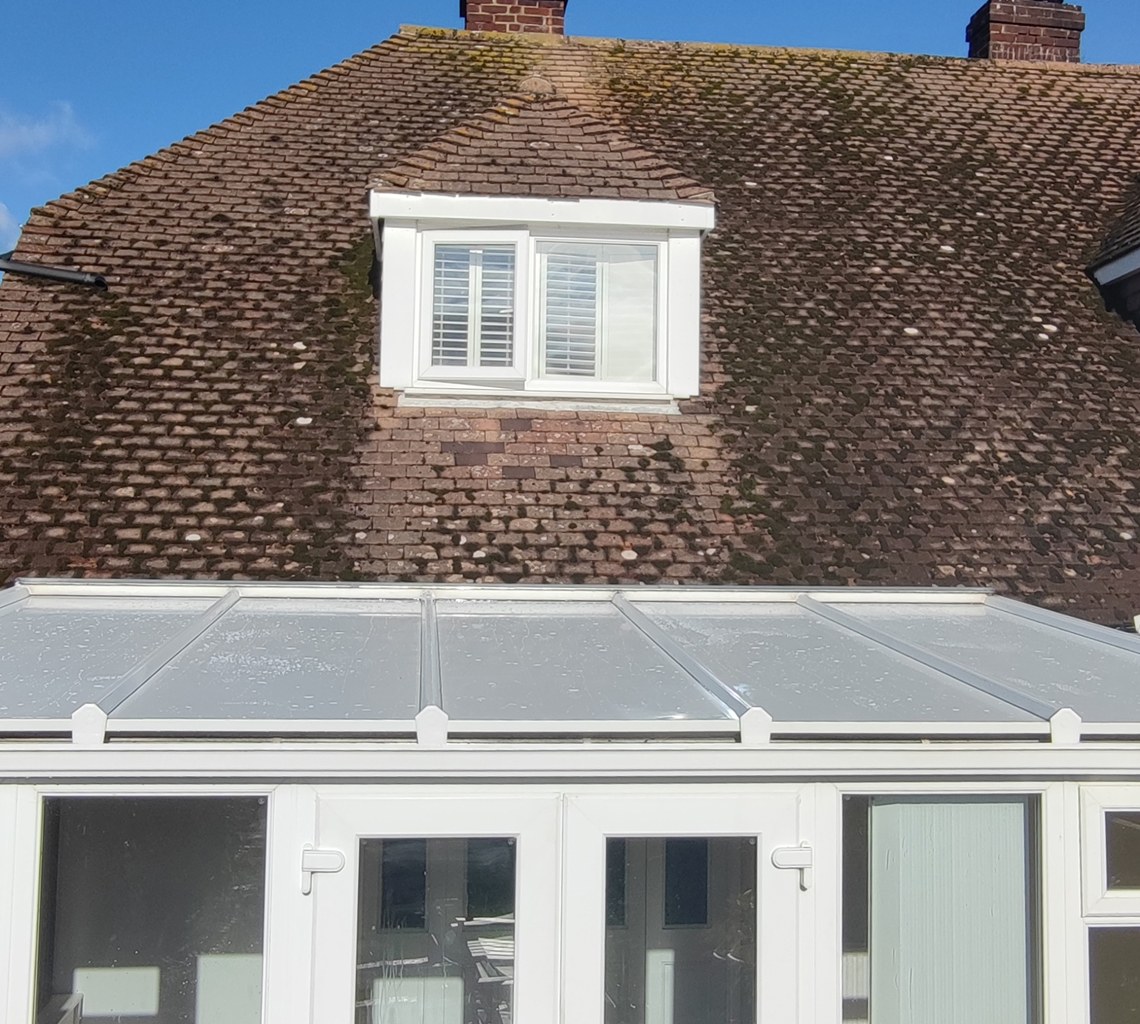 Insulated lean-to roof panels installed on a conservatory, featuring a modern design with a clear panel structure, enhancing energy efficiency and comfort for year-round use.