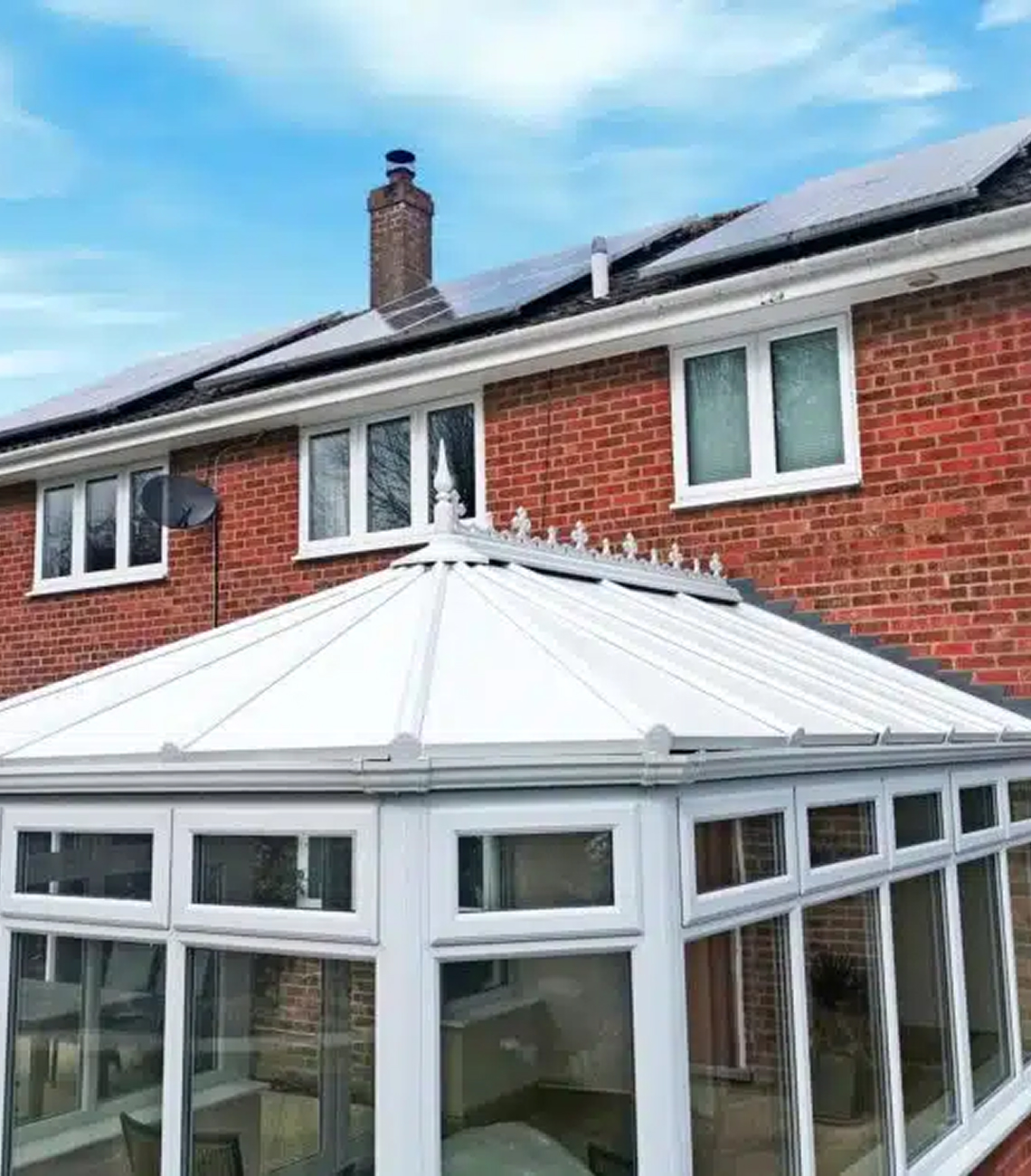 New conservatory roof with modern design and solar panels, enhancing energy efficiency in Coventry home.