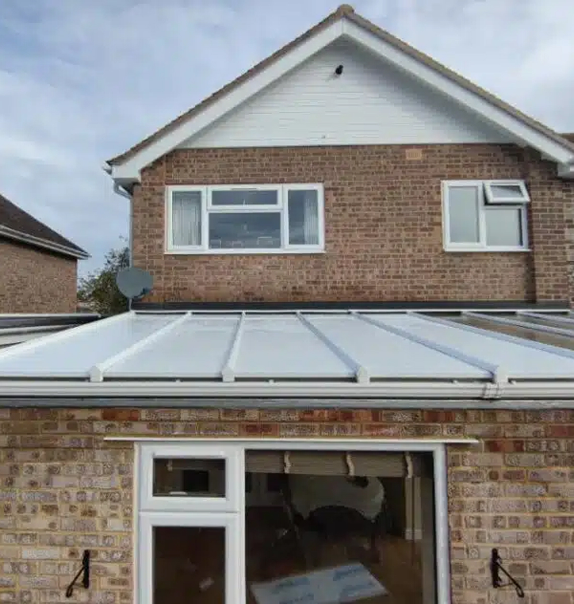 Conservatory roof replacement showcasing a modern insulated roof with polycarbonate panels, enhancing energy efficiency and style for homes in Cardiff.