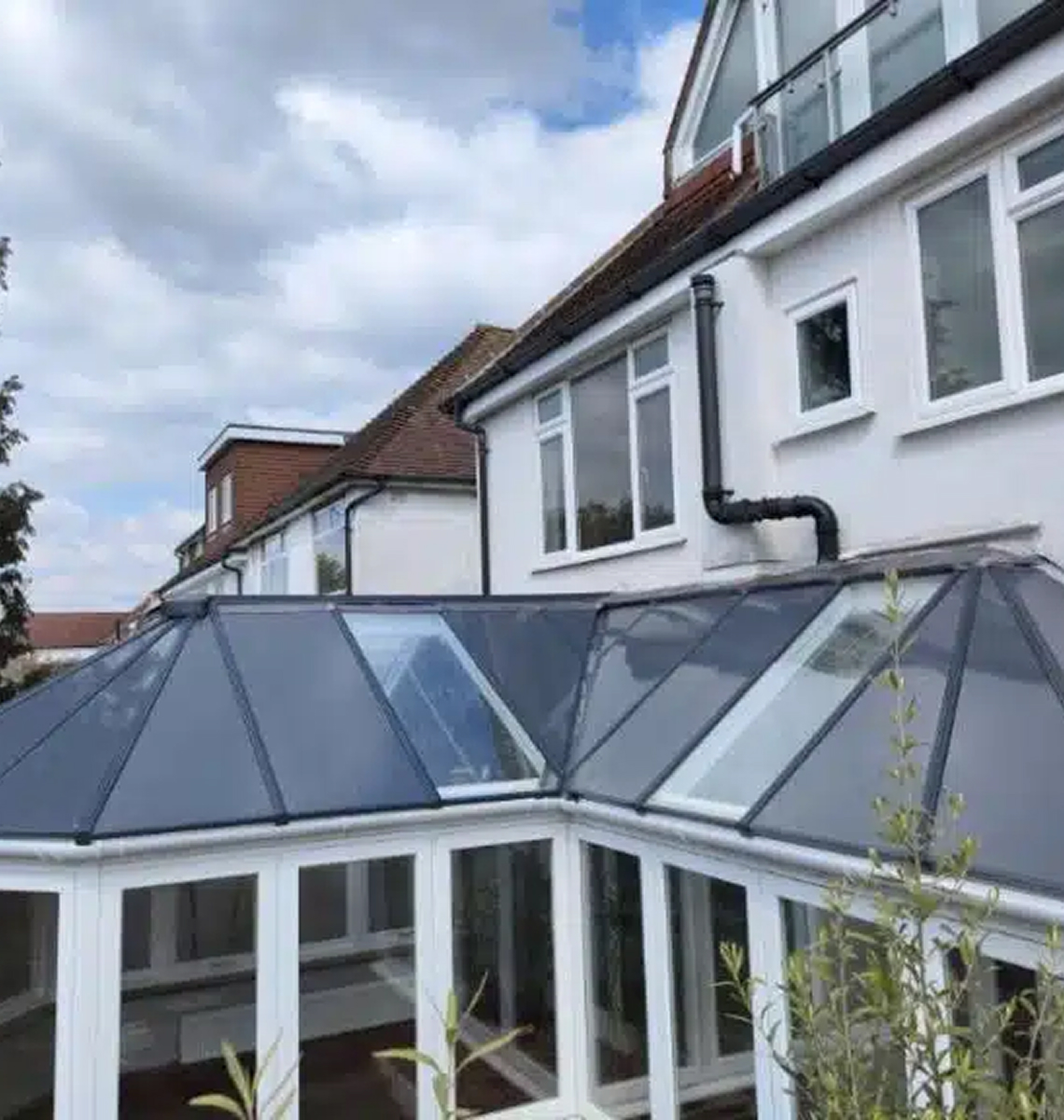 Conservatory roof with modern glass panels and white frame, showcasing energy-efficient design for homes in Wolverhampton.